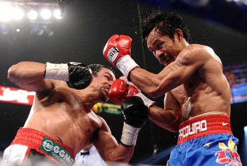 In boxing, why don't fighters punch their way out of the clinch